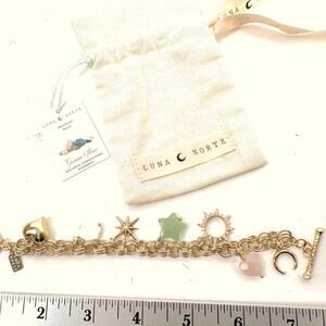 LUNA NORTE gold tone toggle charm bracelet. Semi-precious stones